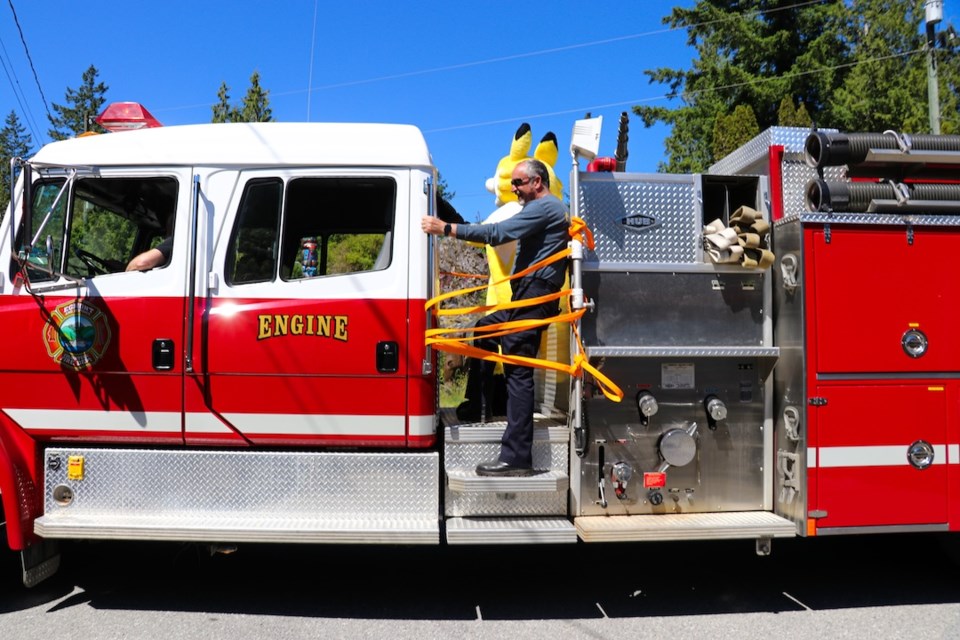 SCRD FireSmart coordinator David McIlwraith and Ember of FireSmart participated in the parade. 